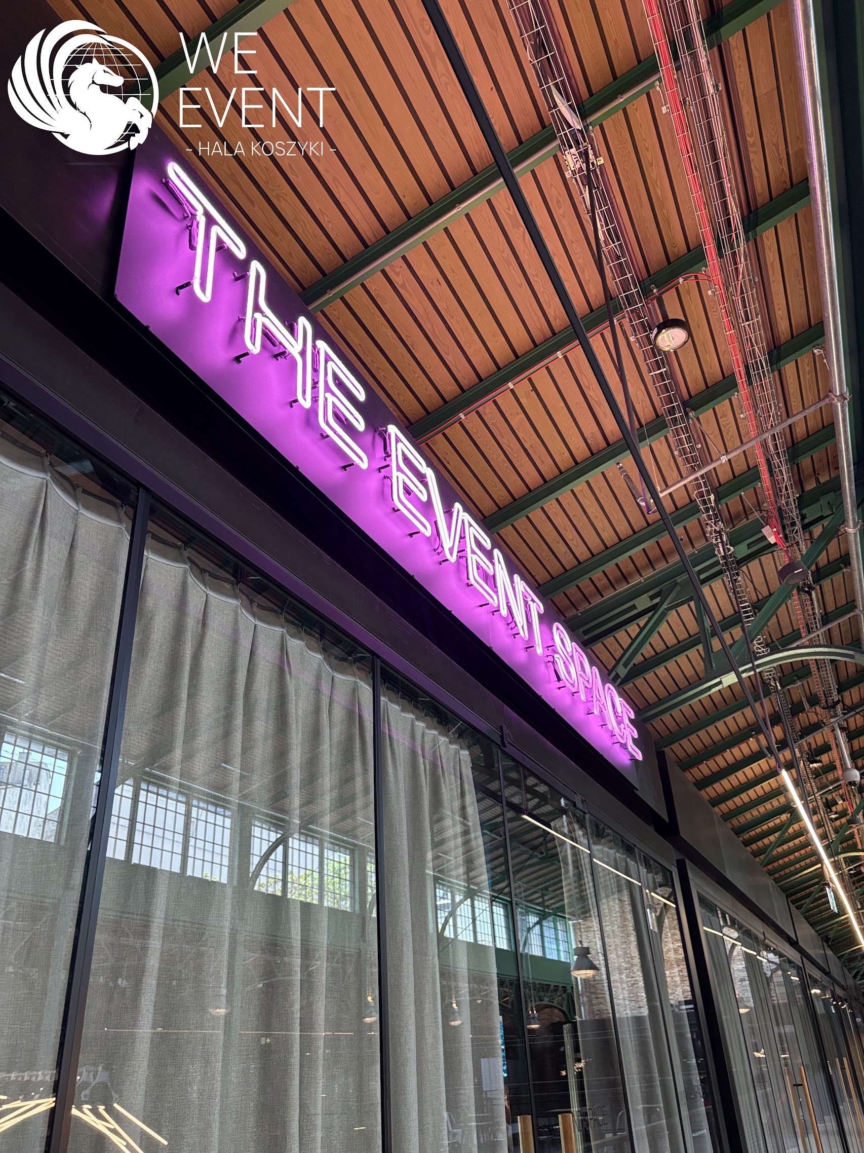 The Event Space neon on the mezzanine of Hala Koszyki, Warsaw